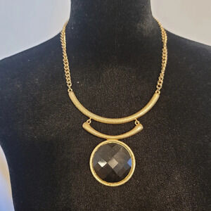 Gold necklace with black stone
